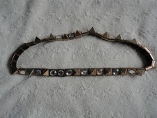 Stretch crystal and spike gold metal belt. Up to 28" waist