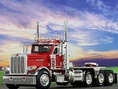 1/64 DCP RED PRIDE & CLASS PETERBILT 389 HEAVY HAUL TRI AXLE DAY CAB - Image 1 of 4
