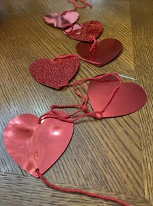 CR27 A String of 6 Red 3" Hanging Hearts - Create a backdrop with these hearts. - Picture 1 of 3