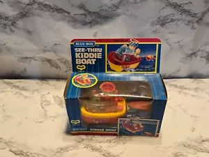 VINTAGE WIND UP KIDDIE BOAT BLUE BOX SEE-THRU NEW - Picture 1 of 3