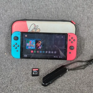Nintendo Switch OLED Videospielkonsole HEG-001 Rot/Blau - Bild 1 von 7