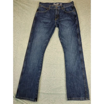 Pantalones de mezclilla Wrangler retro ajustados bootcut para hombre lavado oscuro talla 34x34 vaquero occidental Foto 1 de 4
