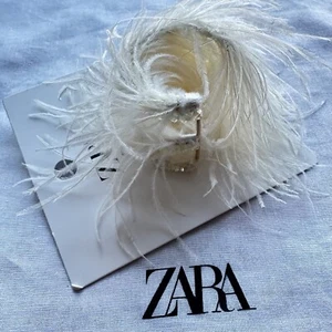 Nuevo brazalete de pluma crema Zara 1856/104 - Imagen 1 de 4
