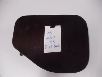 2008 Scion Xb Fuel Door  Color Burgundy OEM good condition - Image 1 of 2