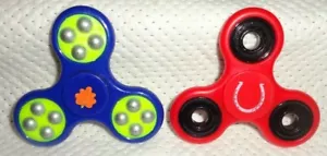 SPINNERS--TWO RED/BLACK AND BLUE/GREEN----L@@K - Picture 1 of 2