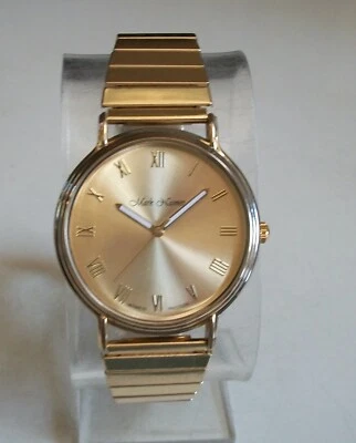 Elegante reloj de pulsera informal con banda elástica acabado dorado de moda para hombre Foto 1 de 4