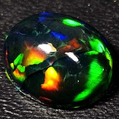 NATURAL AAA+ HONEYCOMB COLORPLAY OVAL CABOCHAN  ETHIOPIAN WELO BLACKOPAL 1.90CTS - Image 1 of 3