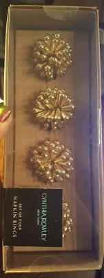 NUEVO Cynthia Rowley Juego de 4 Cuentas Tono Dorado Servilleteros Sunburst Nuevo en Caja Foto 1 de 3
