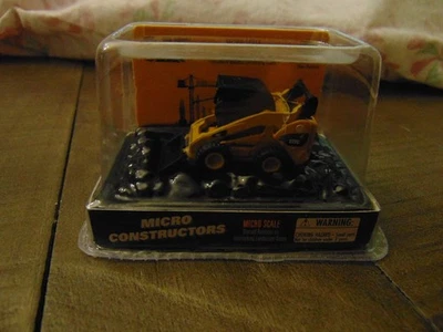 Minicargadora Caterpillar CAT Micro Construction Escala 272c Vehículo de Juguete Foto 1 de 2