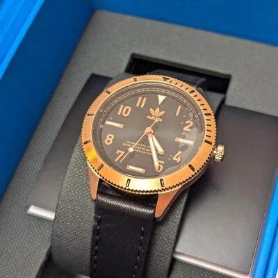 CLEARANCE Adidas Womens Analogue Watch with Black Dial and Gold Case AOFH22504 - Image 1 of 3