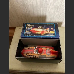 Vintage Blechspielzeug Rocket Racer Figur Auto Maskottchen aus Japan Ware - Bild 1 von 2