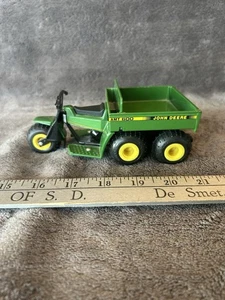 John Deere AMT 600 1/16 ERTL #5597 Die-Cast MIB Mulde, lenkbar, Gummireifen - Bild 1 von 5