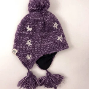 Turtle Fur Kids Purple Knit Winter Pom Pom Hat Ear Flaps White Flower pattern - Picture 1 of 6