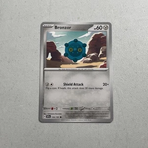 Pokemon TCG Scarlet & Violet: Surging Sparks 2024 Base Card -- Bronzor 126/191 - Picture 1 of 2