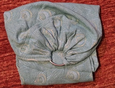 Didymos ▪ Ojo de pavo real (v. 2013) ▪ Eslinga de anillo azul claro ▪ 100 % algodón Foto 1 de 3