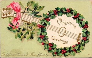 CHRISTMAS GREETINGS Wreath Guitar embossed c1907 UDB Postcard - Picture 1 of 2