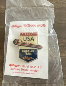 Pin's booster équipe bobsleigh USA Jeux Olympiques 1992 Kellogg NEUF scellé jamais ouvert vintage - Photo 1/2
