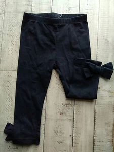 New FIRST IMPRESSIONS Black BABY GIRL'S Bottom bow Leggings Size 18m cotton - Picture 1 of 3