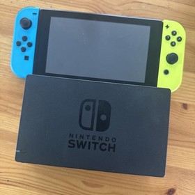 Nintendo Switch  Video Game Console  yellow/Blue includes charger not shown