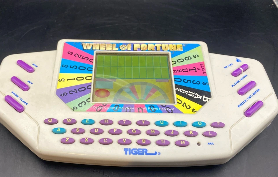 Juego portátil Tiger Electronics Wheel Of Fortune 1995 de colección con cartucho FUNCIONA Foto 1 de 4