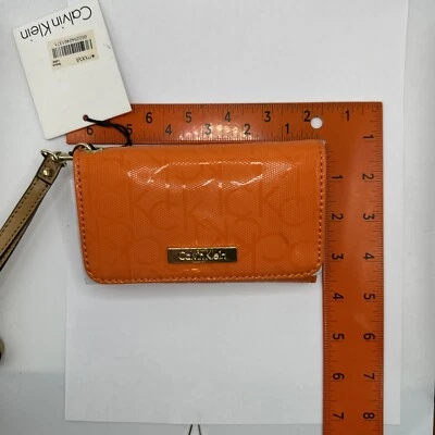 ¡NUEVO! Cartera de muñeca Calvin Klein BTO naranja quemado BTO NUEVO CON ETIQUETAS Foto 1 de 4