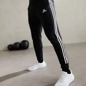 Pantalone Uomo Adidas Essentials Tapered Cuff 3 Stripes IB4030 Nero - Foto 1 di 5
