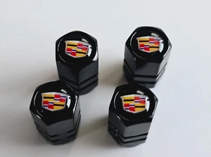 4 Valve Stem Caps Black Hex Fits Cadillac - Picture 1 of 3