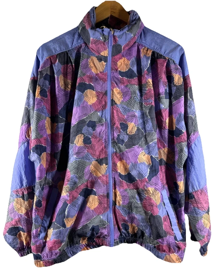 Jaqueta corta-vento vintage anos 90 Y2K Reebok Wms L estampa abstrata capuz streetwear - Imagem 1 de 4