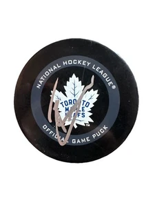JOHN TAVARES AUTOGRAPH SIGNED NHL HOCKEY GAME PUCK TORONTO MAPLE LEAFS - Picture 1 of 2