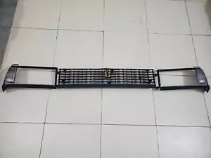Toyota Corolla KE70, TE70 1982 Front Headlight Bezel & Grill with Parking New - Picture 1 of 15