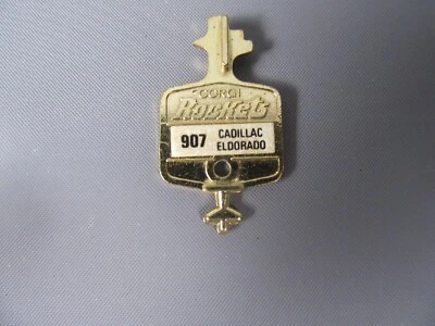 B157 Vintage 1969 Corgi Rockets 907 UK Cadillac Eldorado Chiave Oro Metallo - Immagine 1 di 2