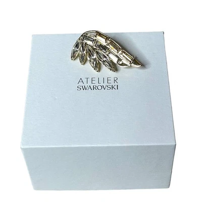 Broche Atelier Swarovski Wonder Woman tono dorado, chapado en tono dorado Foto 1 de 4