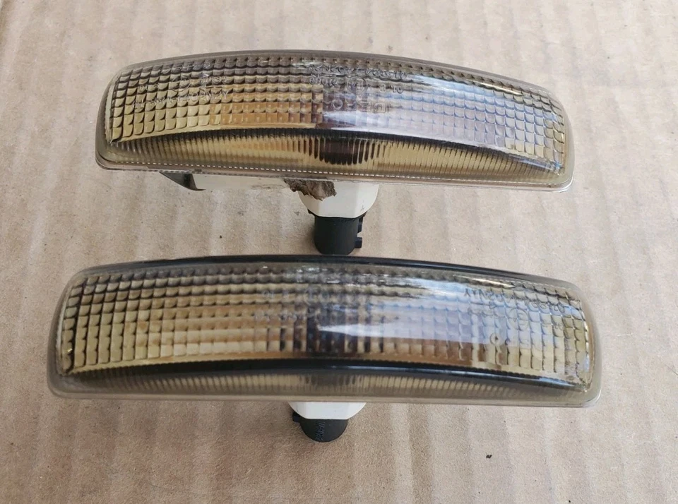 LAND ROVER LR2 / LR3 / LR4 LÂMPADAS INDICADORAS FUMÊ COM LÂMPADAS LARANJA CONJUNTO DE 2 FABRICANTE DE EQUIPAMENTO ORIGINAL - Imagem 1 de 3