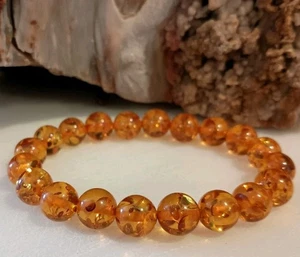 7.5" 10 MM BEAUTIFUL SPARKLING ORANGE GENUINE BALTIC AMBER STRETCH BRACELET - Picture 1 of 5
