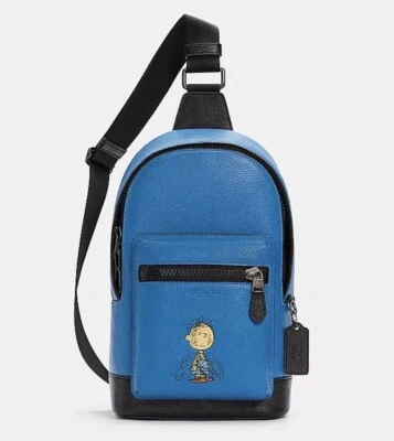 Mochila eslinga COACH x Peanuts West Pack con bolígrafo de cerdo en azul/negro c4151 - nueva con etiquetas Foto 1 de 4