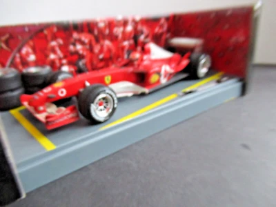 Mattel Hot Wheels Racing 1:18 Ferrari F1 2003 M. Schumacher Re della Pioggia - Immagine 1 di 4