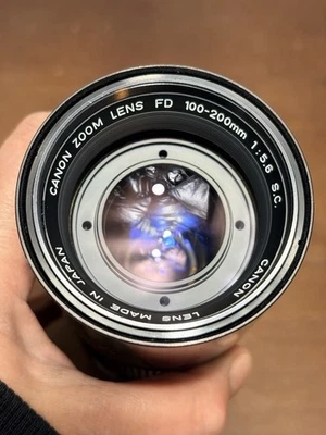 Lente zoom para cámara Canon FD 100-200 mm 1:5,6 de colección con tapas Foto 1 de 4
