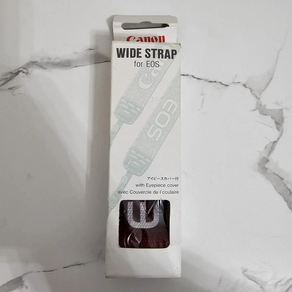 Correa ancha Canon para Eos con cubierta para ocular EW-100MA Foto 1 de 4