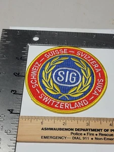 Sig Suiza Circular Arma de Fuego Pistola Parche Sombrero Camisa Chaqueta - Imagen 1 de 2