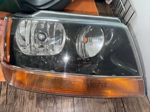 JEEP GRAND CHEROKEE LAREDO 1994-04 SCHEINWERFER LINKE SEITE - Bild 1 von 2