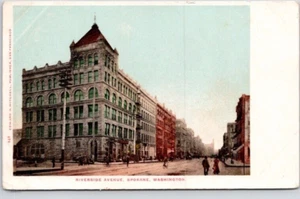 SPOKANE, WASH. POSTCARD Riverside Ave.  Vintage,  Unpaved, Bicycle Riders - Picture 1 of 2