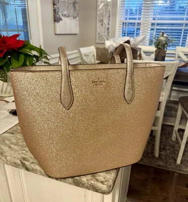 Bolso de mano Kate Spade grande dorado brillante Foto 1 de 4