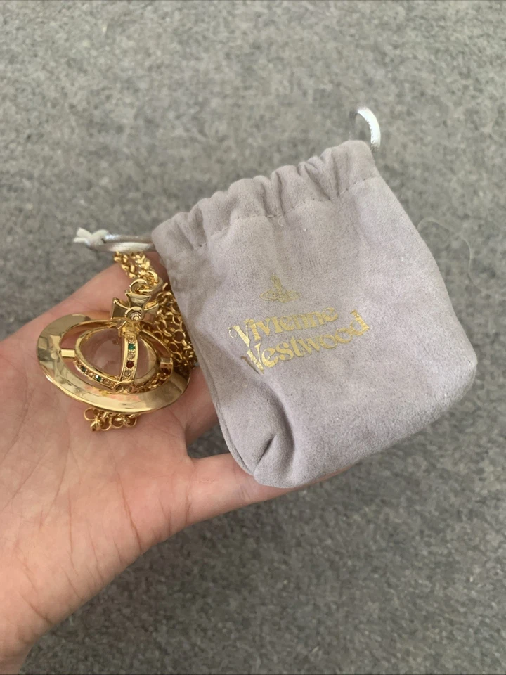 Vivienne Westwood Necklace Gun Metal Orb Pendant with gold - Image 1 of 4