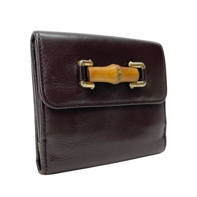 Cartera Gucci de cuero de bambú marrón oscuro con gancho usada con monedas Foto 1 de 4