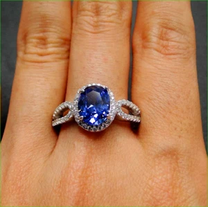 Alianza de compromiso con halo de tanzanita azul corte ovalado de 2 quilates acabado en oro blanco de 14 quilates - Imagen 1 de 1