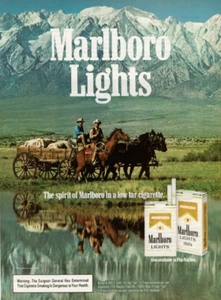 Anuncio impreso vintage 1985 El espíritu de Marlboro luces vaqueros caballo y carruajes - Imagen 1 de 2