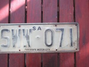 SA; 1 x heavy metal  number plate # SWW-071 CITY STATE MOTOR CITY - PATTENED RIM