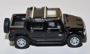 Modellino Kinsmart Hummer H2 SUT Retrocarica Nero Scala 1:40 - Foto 1 di 5