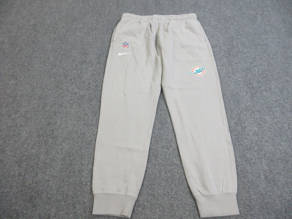 Pantalones deportivos Nike de fútbol americano emitidos por el equipo gris grande de los Miami Dolphins para hombre Foto 1 de 4