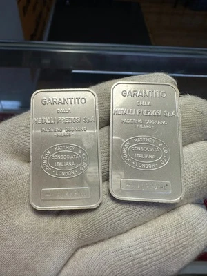 (2) Barra de plata Johnson Matthey Italia Garantito Metalli Preziosi MP 1 oz Foto 1 de 4